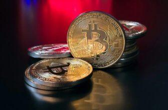 a pile of bitcoins sitting on top of a table