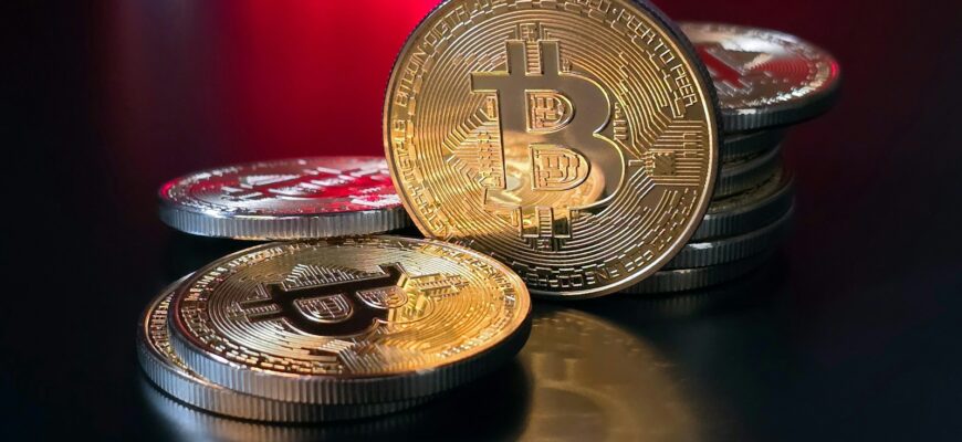 a pile of bitcoins sitting on top of a table